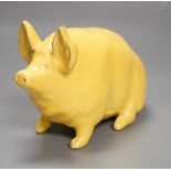 A Wemyss ware yellow glazed pig, 17cms long