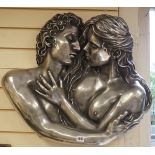 A composite wall mount modelled as embracing lovers, 65cm wide