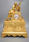 A 19th century French ormolu mounted clock with seated female Harpist decoration, with key, 49cm