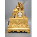 A 19th century French ormolu mounted clock with seated female Harpist decoration, with key, 49cm