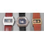 Three assorted steel or gilt steel jump hour digital manual wind wrist watches, including Astral and