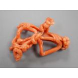 A yellow metal mounted coral 'floral knot' brooch, 56mm.