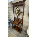 A late Victorian mahogany hall stand with shield silvered mirror, width 84cm, height 203cm