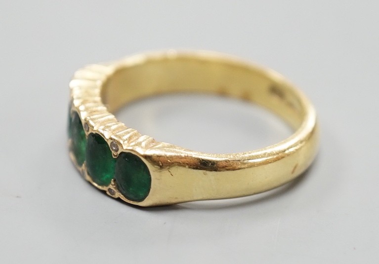 A modern 18ct gold and graduated five stone emerald set half hoop ring, with diamond chip spacers, - Image 2 of 4