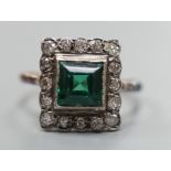 An 18ct gold, green paste? and diamond set square cluster ring, size L, gross weight 2.2 grams.