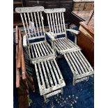 A pair of weathered teak garden steamer chairs and three Sou-wester teak deckchairs