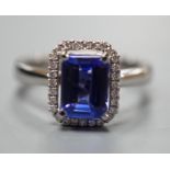 A modern 18k white metal, tanzanite and diamond set rectangular cluster dress ring, size M, gross