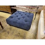 A contemporary buttoned blue fabric footstool, 80cm square, 33cm high