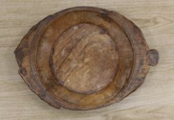 An 18th century/19th century provincial elm serving dish58 cms wide,