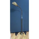 An early 20th century brass adjusting telescopic floor lamp