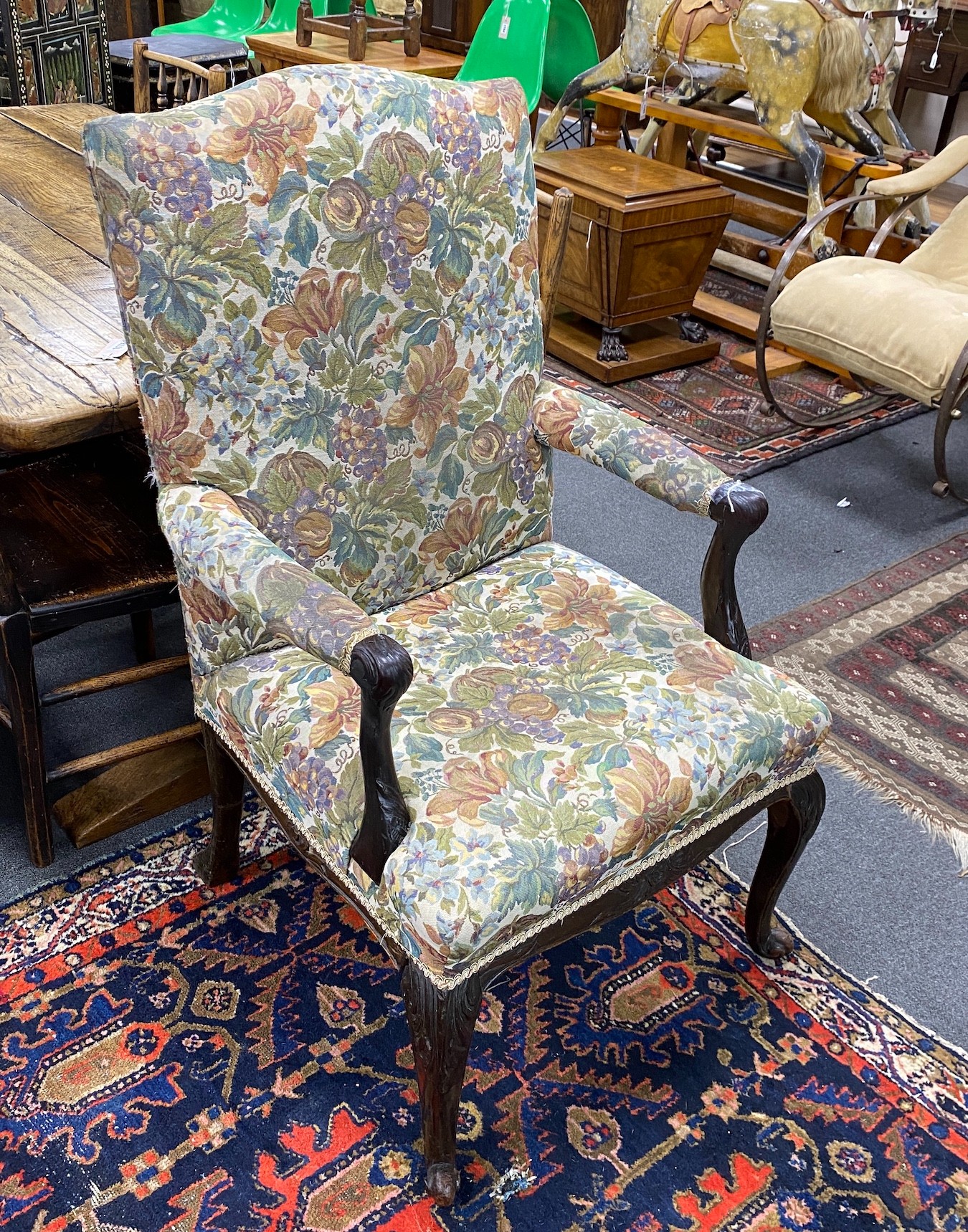 A George III upholstered open armchair, width 62cm, depth 58cm, height 108cm