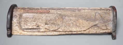 An 18th/early 19th century scrimshaw whale bone carving, 19cm