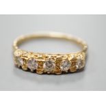 A modern 18ct gold and graduated five stone diamond set half hoop ring, size T, gross weight 3.8
