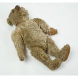 A Steiff teddy bear with button in ear, circa 1910, 35cm