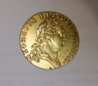 A George III 1788 gold spade guinea, good VF.