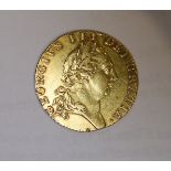 A George III 1788 gold spade guinea, good VF.