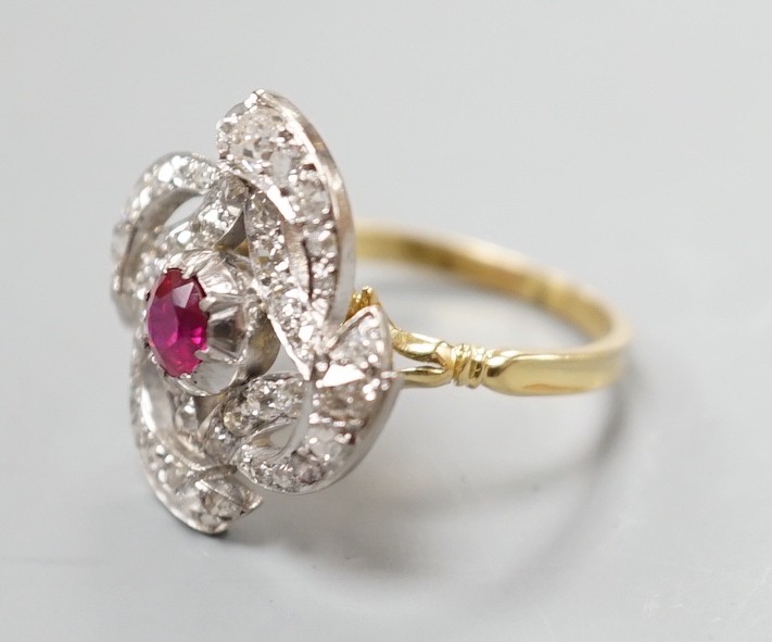 A yellow metal, ruby and diamond cluster set dress ring, in a pierced scroll setting, size O, - Image 3 of 5