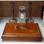 A silver mounted spirit decanter, a pair of plated candlesticks and canteen box,decanter 24 cms
