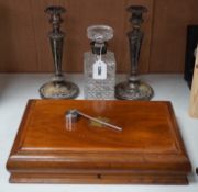 A silver mounted spirit decanter, a pair of plated candlesticks and canteen box,decanter 24 cms