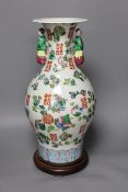 A Chinese famille rose vase, on plinth, 46 cms high,