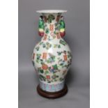 A Chinese famille rose vase, on plinth, 46 cms high,