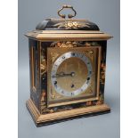 A F.W. Elliott japanned mantel clock, with chiming mechanism, 32 cms high,