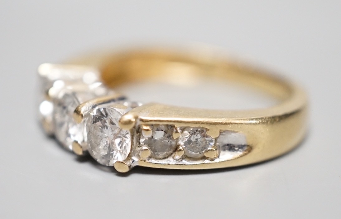 A 14k yellow metal and three stone diamond ring, with four stone diamond set shoulders, size K, - Image 3 of 5