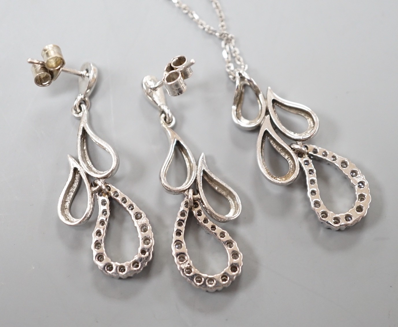 A modern white metal and diamond set quadruple teardrop shaped cluster drop pendant, 28mm, on a - Image 3 of 3