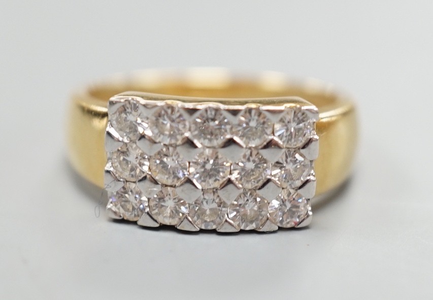 A modern 18ct gold and pave set diamond cluster ring, size K, gross weight 3.9 grams.