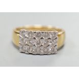 A modern 18ct gold and pave set diamond cluster ring, size K, gross weight 3.9 grams.