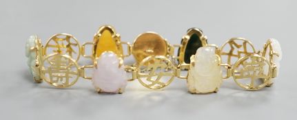 A Chinese 14k yellow metal and hardstone set bracelet, with alternating character and six carved