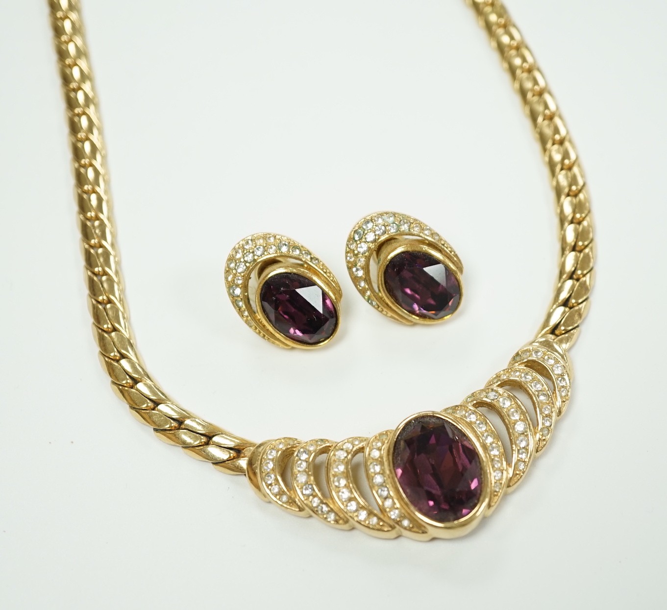 A Cristian Dior gilt metal and two colour paste set costume necklace, 36cm and a pair of matching