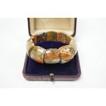 An early 20th century white metal and Scottish hardstone set flexible bracelet, with box.