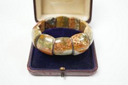 An early 20th century white metal and Scottish hardstone set flexible bracelet, with box.