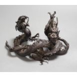 A Japanese bronze group of two entwined dragons, Meiji period, 17cms wide