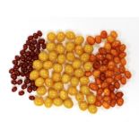 A group of loosed butterscotch amber beads, gross 31 grams, a group of loose yellow amber beads