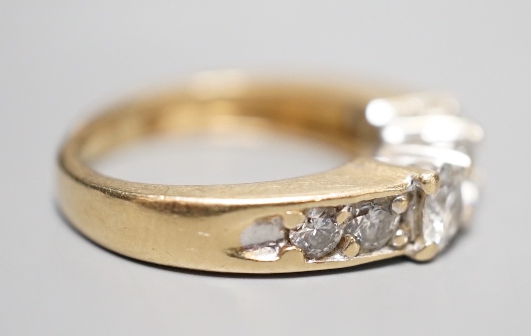 A 14k yellow metal and three stone diamond ring, with four stone diamond set shoulders, size K, - Image 4 of 5