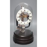 A 1930's electric mantel clock under glass dome, 26cms high