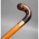 An 18ct gold collared malacca cane, with a horn handled handle, stained as tortoiseshell,94 cms