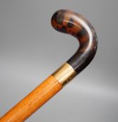 An 18ct gold collared malacca cane, with a horn handled handle, stained as tortoiseshell,94 cms