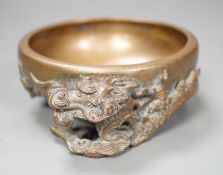A Chinese or Japanese bronze ‘dragon’ dish, 13cm
