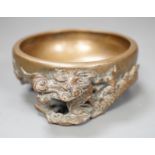 A Chinese or Japanese bronze ‘dragon’ dish, 13cm