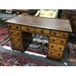 A Victorian oak nine drawer pedestal desk width 117cm, depth 60cm, height 73cm