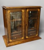 An Edwardian inlaid oak drinks cabinet, with two cut glass decanters, 40 cms wide x 37 cms high,