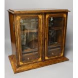 An Edwardian inlaid oak drinks cabinet, with two cut glass decanters, 40 cms wide x 37 cms high,