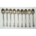 A set of nine 1950's Georg Jensen sterling coffee spoons, with London import marks and Georg