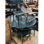 A Victorian style circular aluminium garden table and eight aluminium garden chairs, table 142cm