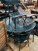 A Victorian style circular aluminium garden table and eight aluminium garden chairs, table 142cm