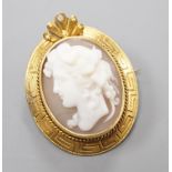 A yellow metal mounted cameo shell brooch, carved with the bust of a lady to dexter, 28mm.