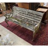 A Victorian slatted wooden garden bench, with pierced cast iron ends, length 128cm, width 60cm,